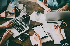 Several people working together on laptops